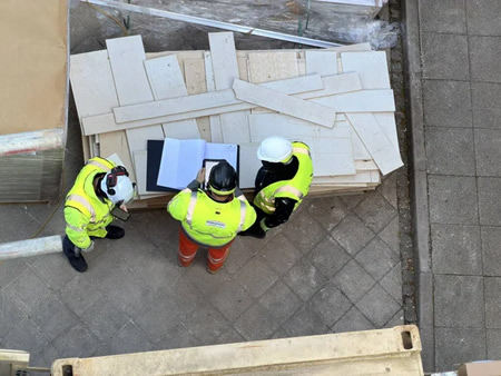 Crew reviewing commercial construction plans at a Perryville, MD jobsite